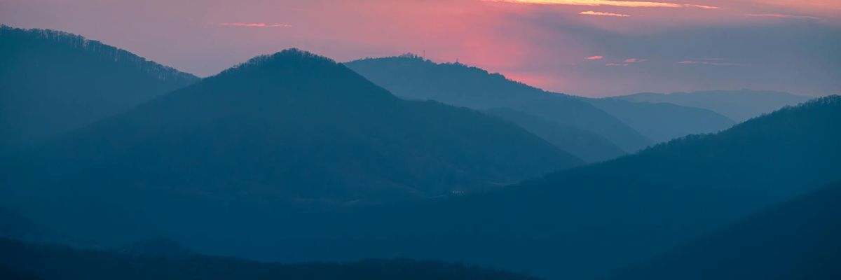 Wide abstract view of a serene natural landscape with soft light